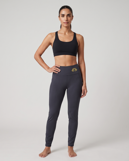 Model wearing Logo Bloom yoga pants, front view with lotus logo