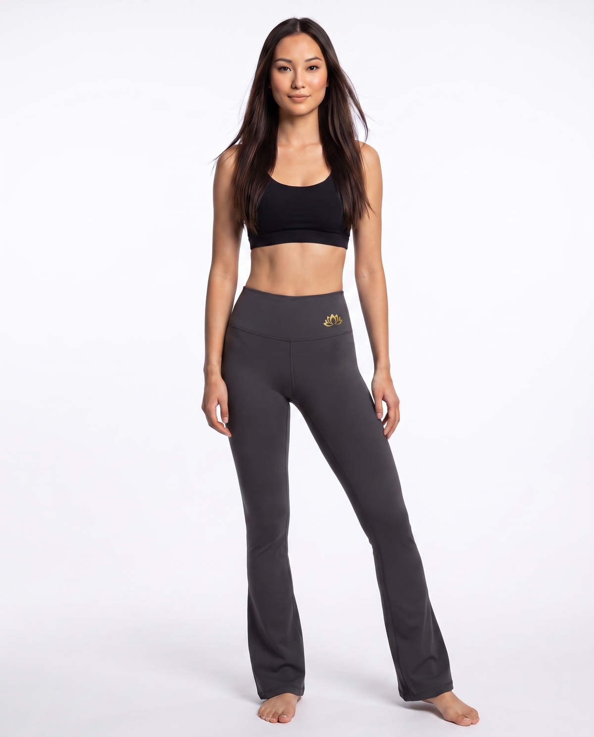 Bloom Flared Leggings in charcoal grey with gold lotus emblem on the waistband